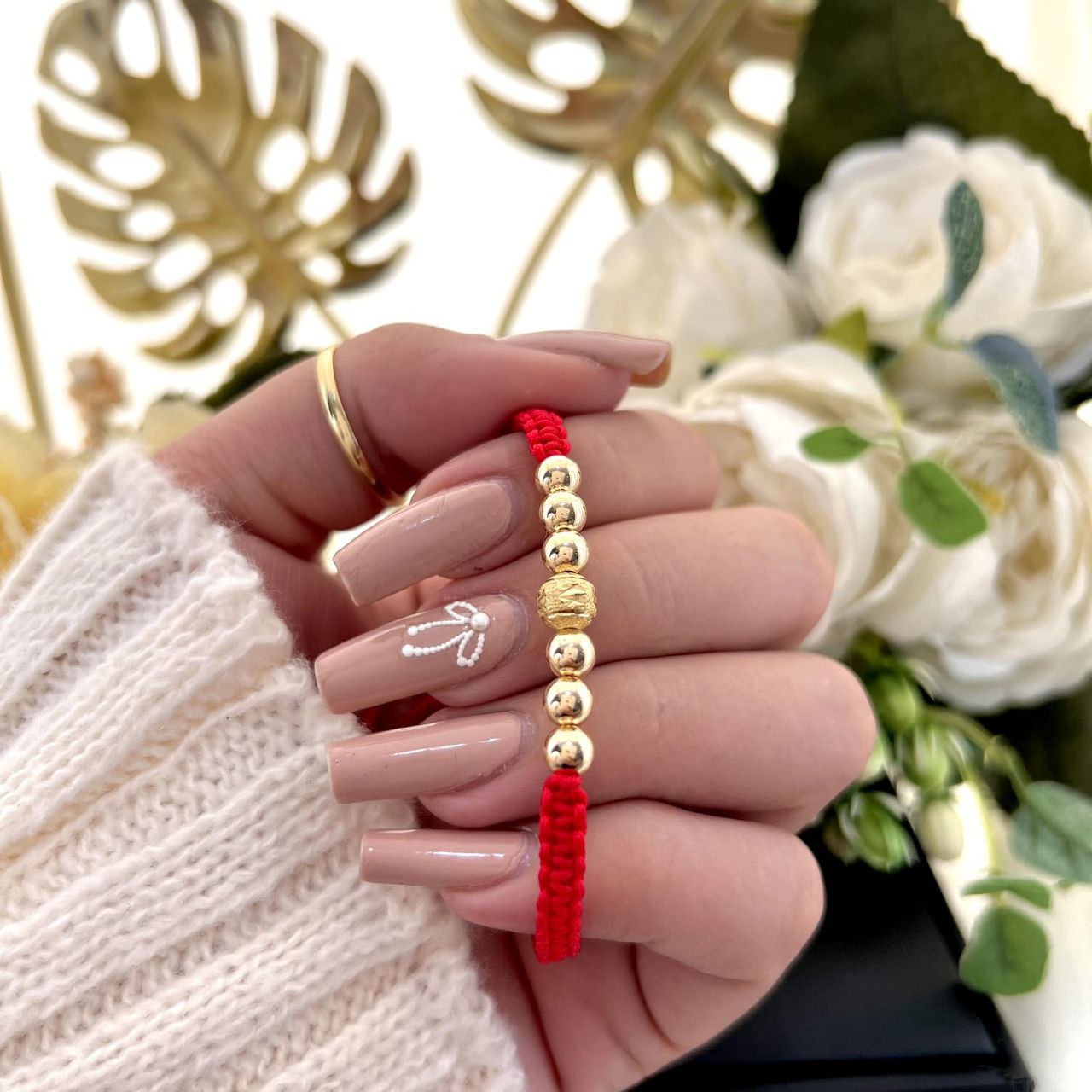 Manilla elaborada con 6 balines 5mm blz, 1 balin 6mm diamantado